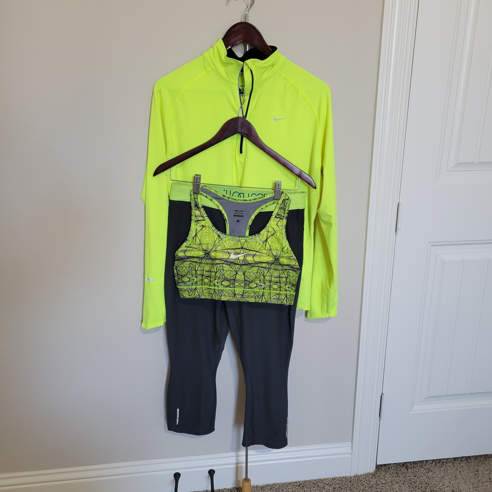 Nike Bright Yellow Jacket and Patterned Sports Bra with Dark Gray Leggings